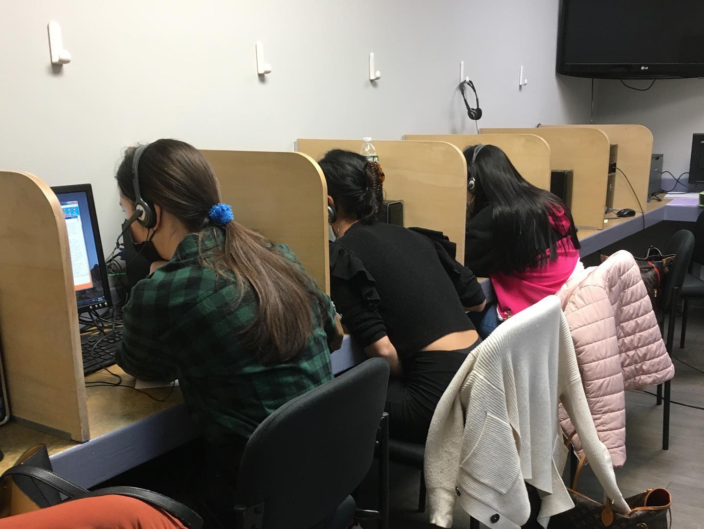Students practicing business English in a workplace-style setting